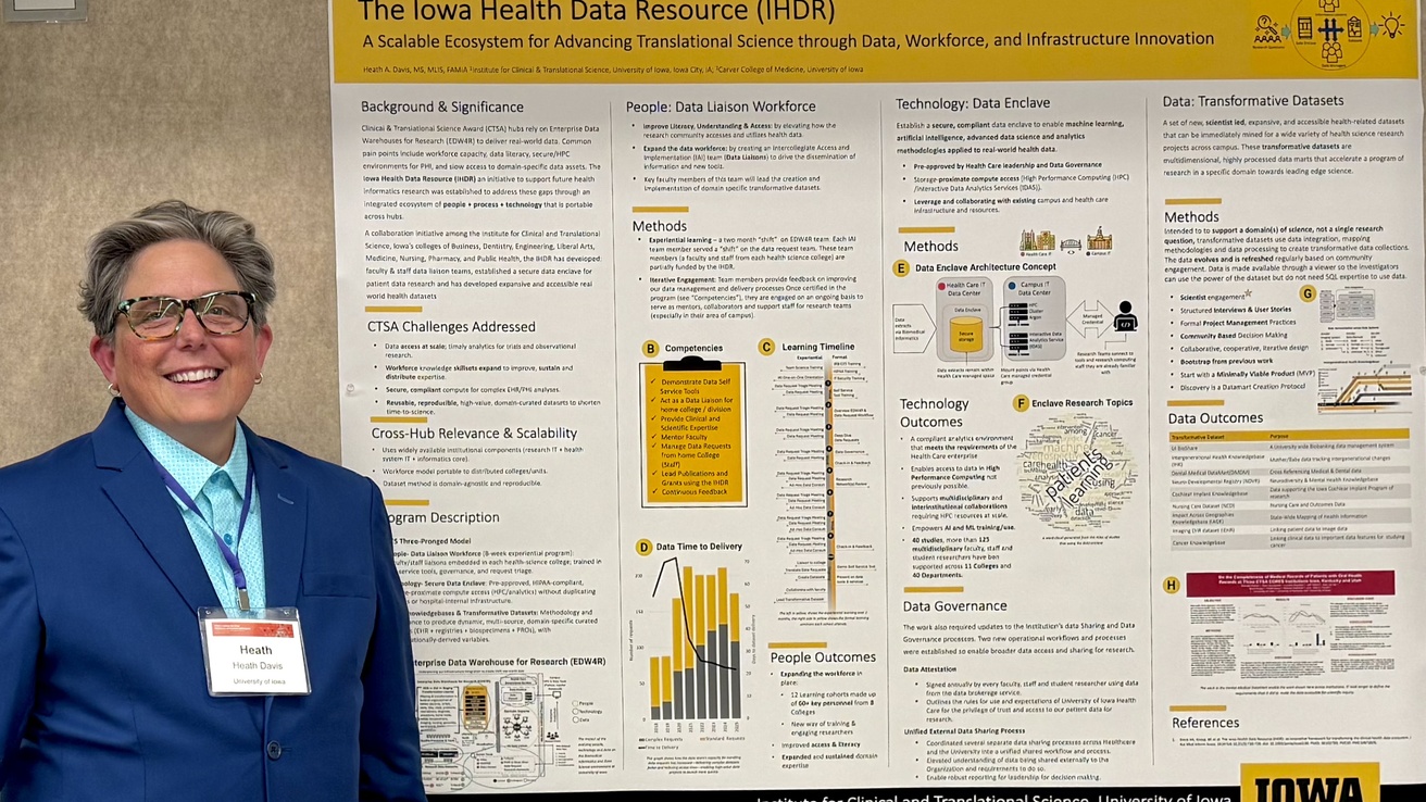 Heath Davis stands with Iowa Health Data Resource Poster 