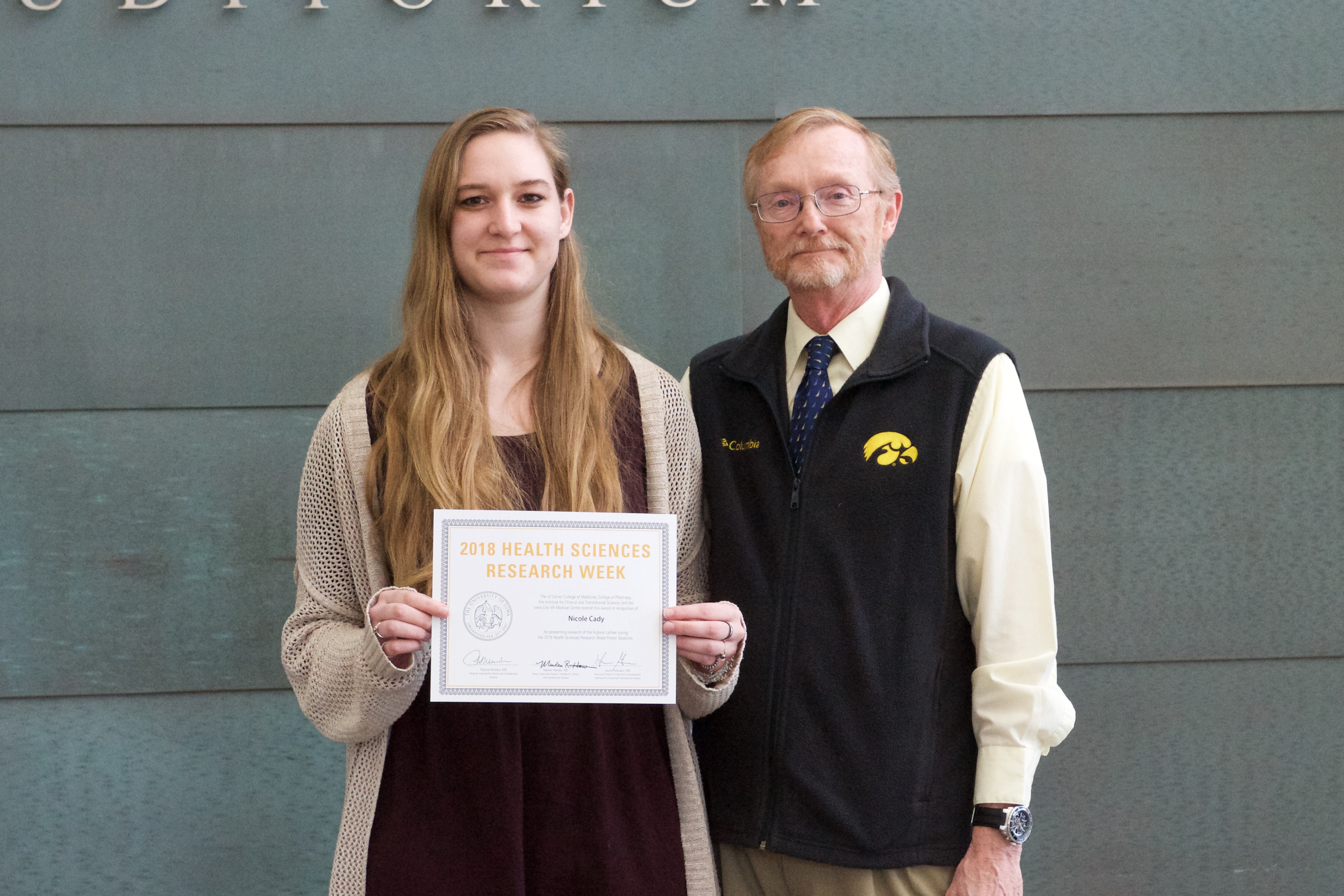 Nicole Cady receiving award